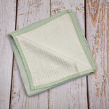 Mint green double sided organic muslin blanket for babies and toddlers. Mint green & ivory
