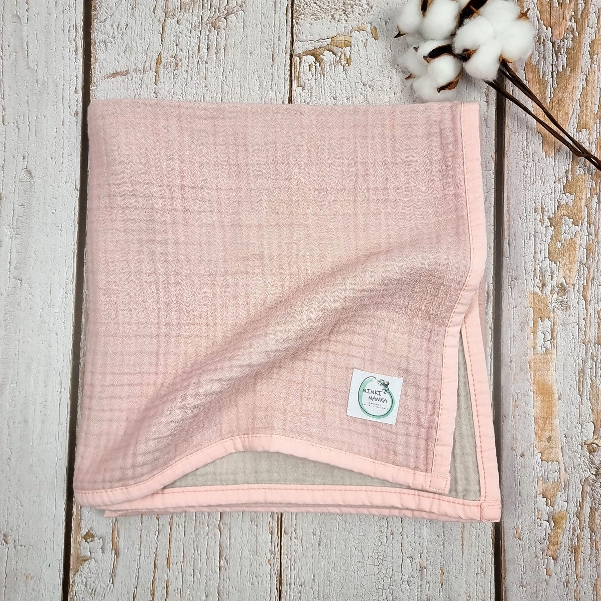 Soft pink double sided organic muslin blanket for babies and toddlers. Light pink & light grey
