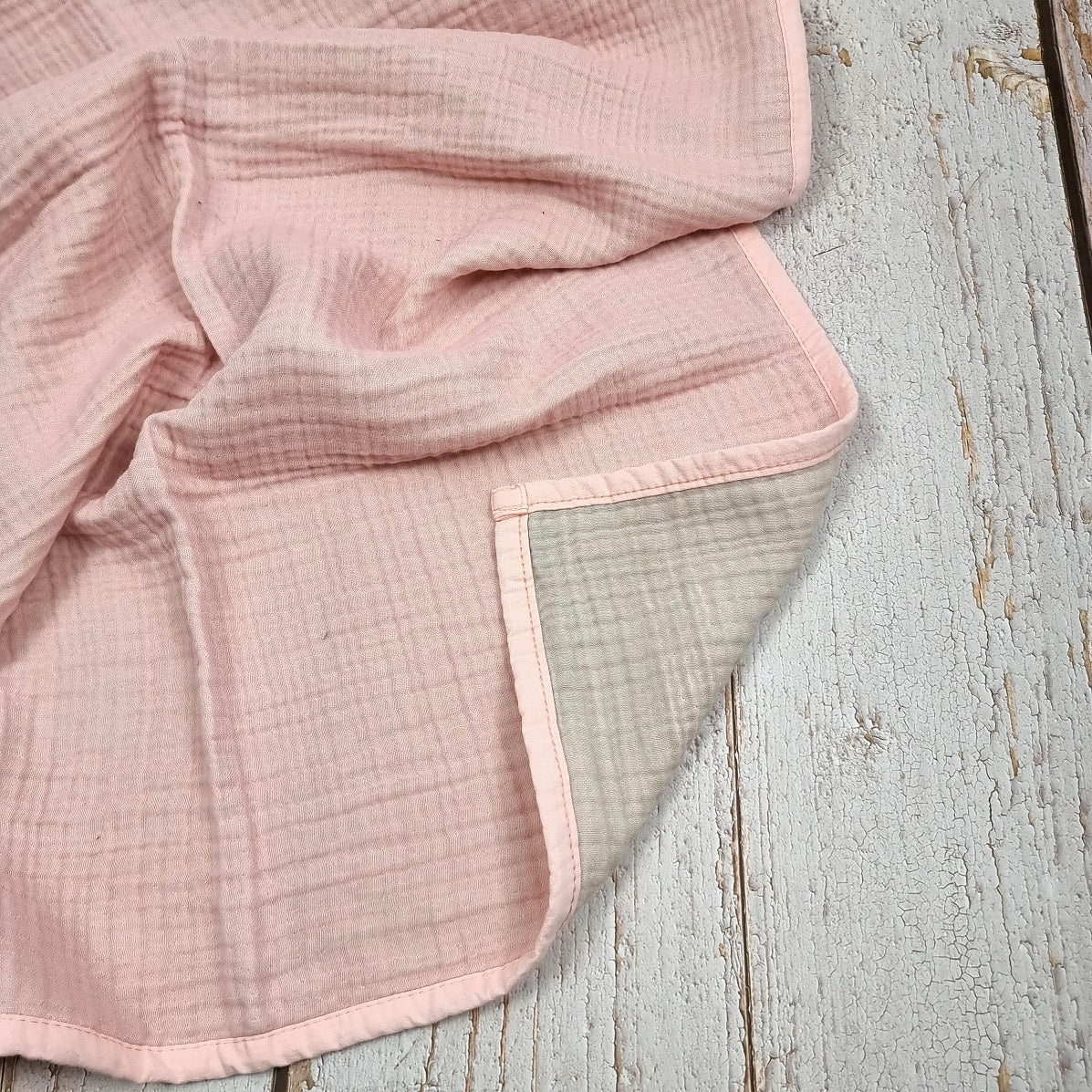 Soft pink double sided organic muslin blanket for babies and toddlers. Light pink & light grey