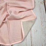 Soft pink double sided organic muslin blanket for babies and toddlers. Light pink & light grey